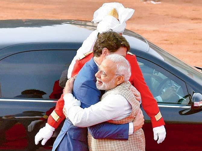 Prime Minister Narendra Modi hugs his Canadian counterpart Justin Trudeau at Rashtrapati Bhawan. Pic/PTI
