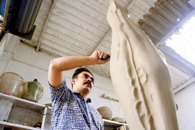 Parag Tandel at work on a sculpture modelled on a fish bone