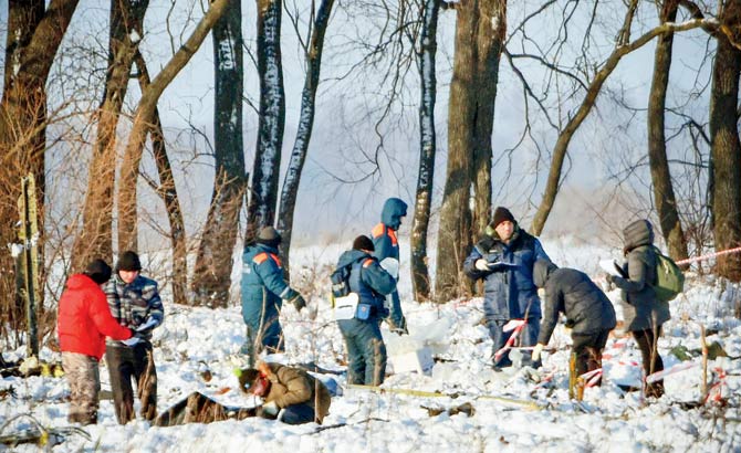 Russian Emergency Ministry rescuers work at the site of the plane crash on Monday. Pic/AFP
