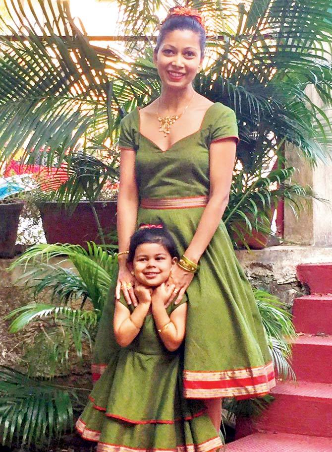 Reena and her daughter wear the lugra dresses she designed