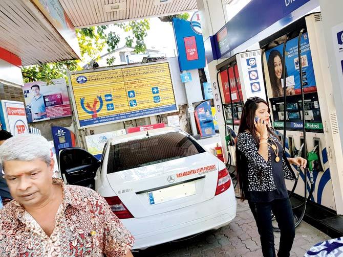 Bandra resident Shabnam Abdul Hamid Sheikh at the petrol pump on SV Road, right after the windshield of her Mercedes Benz cracked