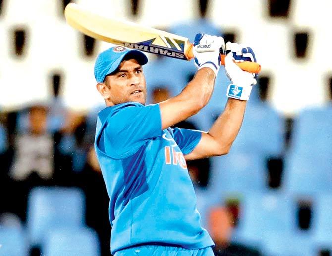 Team India batsman Mahendra Singh Dhoni hits out during the second T20I against SA at the Centurion on Wednesday. Pic/AP, PTI
