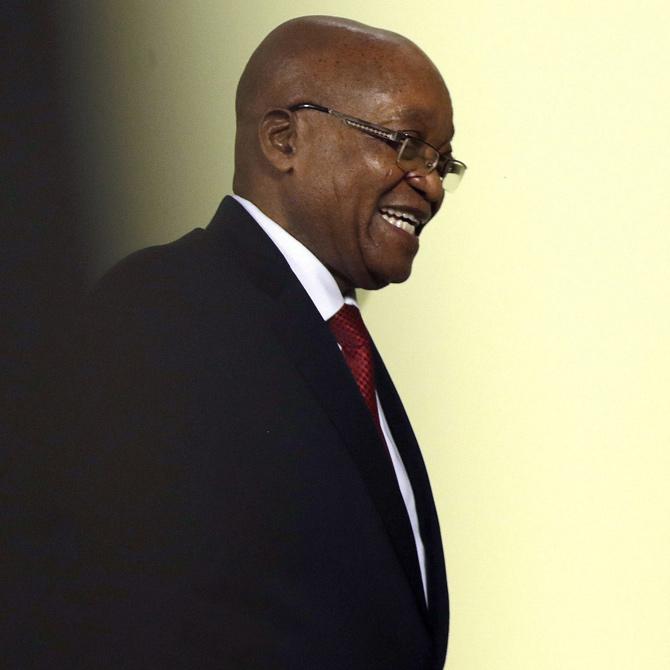 South African President Jacob Zuma leaves after addressing the the nation and the press at the government
