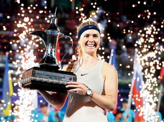 Ukraines Elina Svitolina with the Dubai Open trophy after beating Russias Daria Kasatkina 6-4, 6-0 on Saturday. pic/AFP