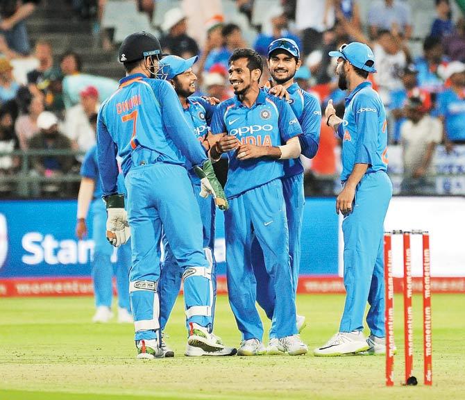 Indian players celebrate the dismissal of South Africa’s Chris Morris during the third ODI at Newlands in Cape Town on Wednesday. Pic/AFP