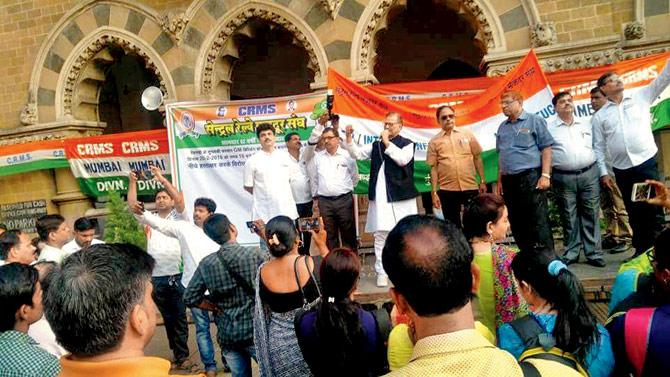 Railway employees protest in the courtyard of CSMT