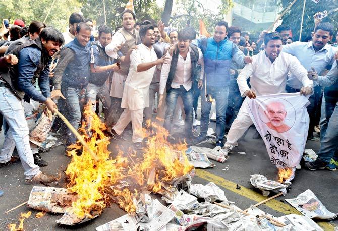 Youth Congress activists burn effigies of Nirav Modi as they raise slogans against the PNB fraud case in New Delhi. File pic/PTI