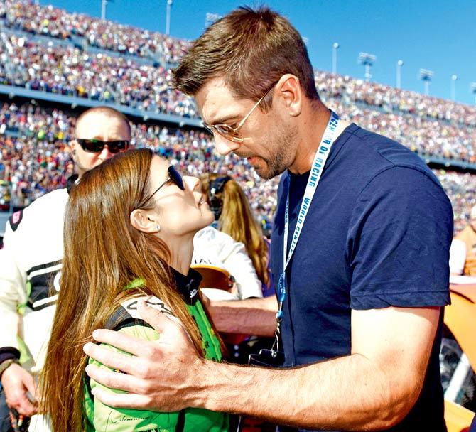 Danica Patrick and Aaron Rodgers in Florida last week. Pic/AFP