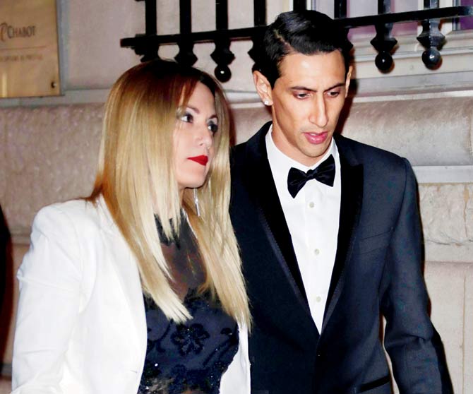 Angel Di Maria and wife Jorgelina Cardoso arrive at the Pavillon Cambon in Paris