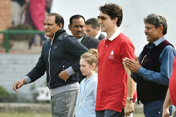 Canadian Prime Minister Justin Trudeau with his daughter Ella-Grace and former Indian cricket team captains Kapil Dev and Mohammad Azharuddin. Pic/ PTI