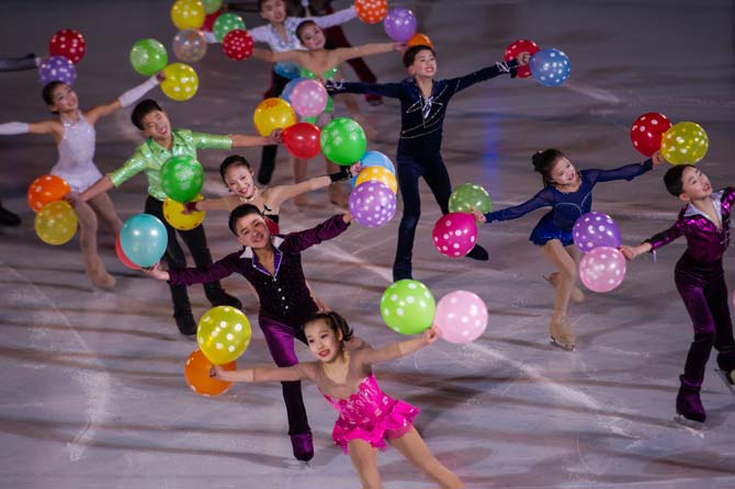Figure skaters perform during the opening ceremony of a figure skating festival marking the anniversary of the birth of late North Korean leader Kim Jong Il at an ice rink in Pyongyang on February 14, 2018. / AFP Photo 