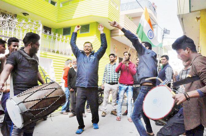 Relatives of Shiva Singh celebrate India’s win over Australia in the ICC U-19 World Cup in Patna on Saturday. PIC/PTI
