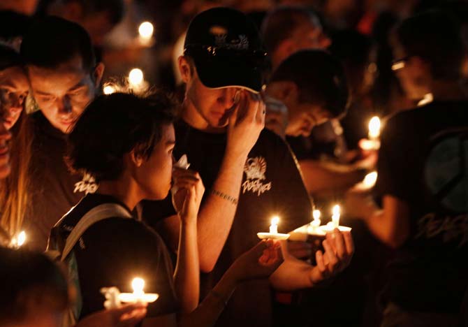 Thousands of mourners hold candles a candlelight vigil for victims of the Marjory Stoneman Douglas High School shooting in Parkland, Florida on February 15, 2018. A former student, Nikolas Cruz, opened fire at the Florida high school leaving 17 people dead and 15 injured. Pic/ AFP
