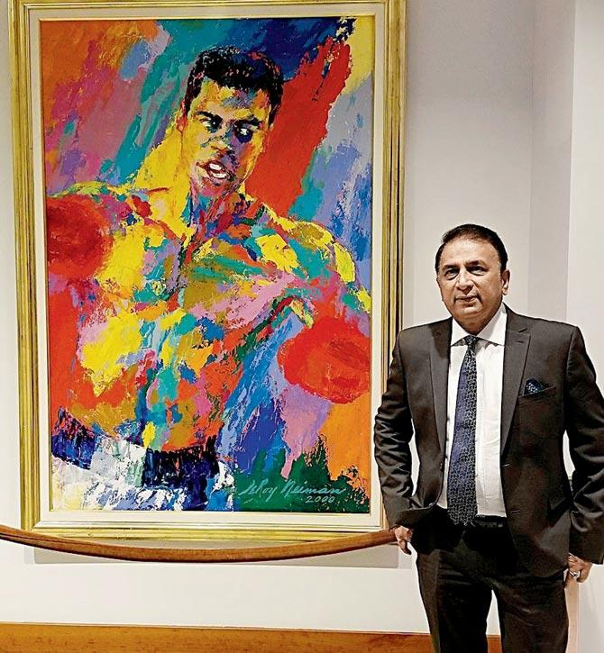 Sunil Gavaskar poses alongside a Muhammad Ali painting in Louisville last year. Pic/Atul Huckoo