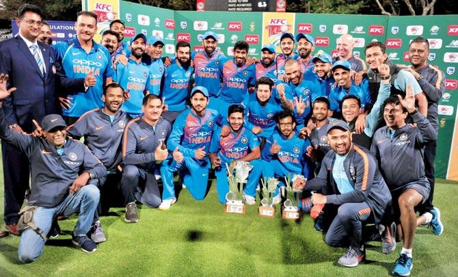 The victorious Indian team after beating South Africa in the third T20I to win the series 2-1 at Cape Town on Saturday; (below) India captain Virat Kohli with the ICC Test Championship mace after the visitors retained their No. 1 Test ranking. pics/ap, pti, icc media