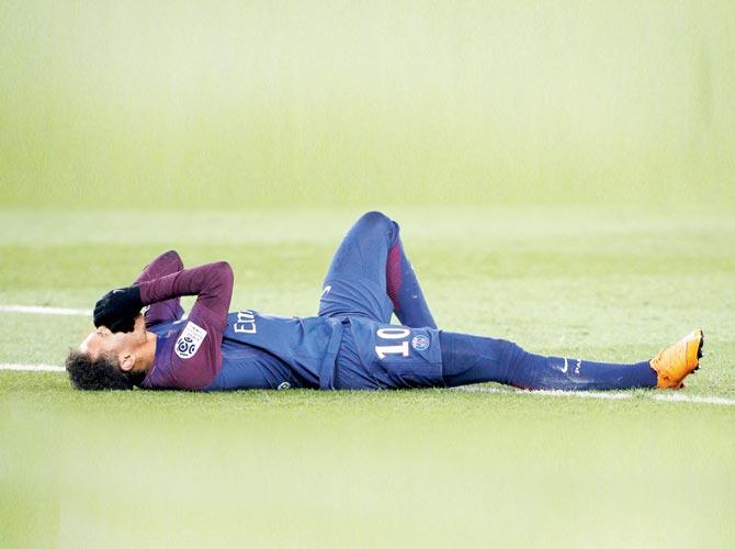  PSG forward Neymar winces in pain after suffering an injury against Marseille on Saturday. pic/AFP
