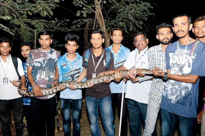 Residents with the snake. Pics/ Rajesh Gupta