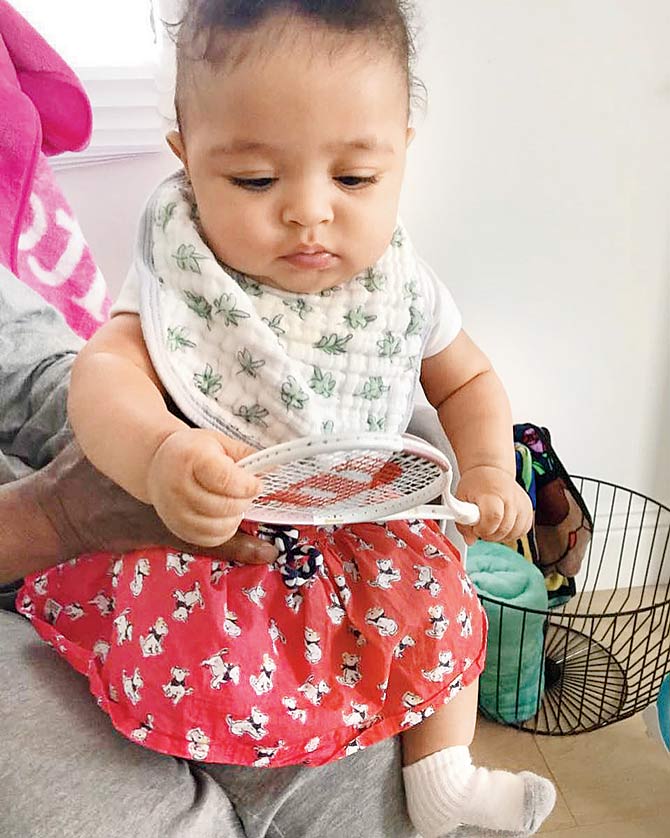 American tennis ace Serena Williams posted this picture of her daughter Alexis Olympia Ohanian Jr. holding a tiny Wilson tennis racquet