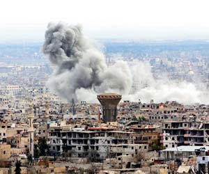 Air raids, rockets hit Syria despite 'humanitarian pause'