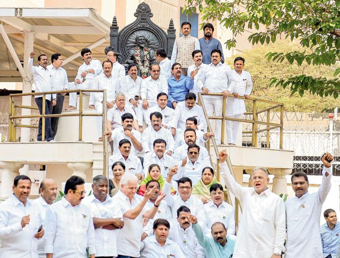 NCP and Congress MLAs protest against the state government on the first day of the budget session at Vidhan Bhavan on Monday. Pic/PTI