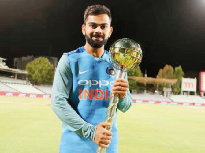India captain Virat Kohli with the ICC Test Championship mace after the visitors retained their No. 1 Test ranking. Pics/AP, PTI, ICC media
