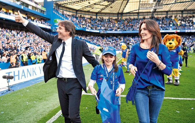 Chelsea manager Antonio Conte (left) with daughter Vittoria and wife Elisabetta celebrate the win over Sunderland in May last year