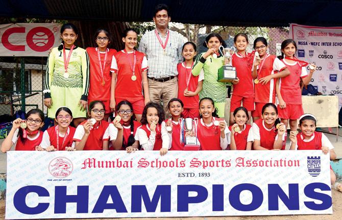 Smt RSBâÂÂu00c2u0080ÂÂu00c2u0088Arya Vidya Mandir girls pose with their medals after winning the MSSA U-12 football title yesterday. pics/Suresh Karkera