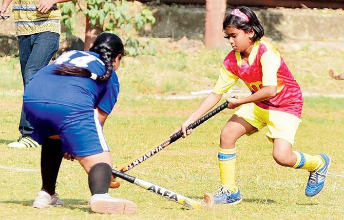 Mary Immaculate’s Asmi Dukhande (right) battles for possession  with a St Anne