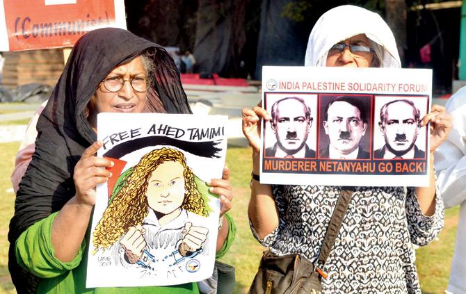 Protestors with banners of Ahed Tamimi at Azad Maidan yesterday. Pics/Datta Kumbhar