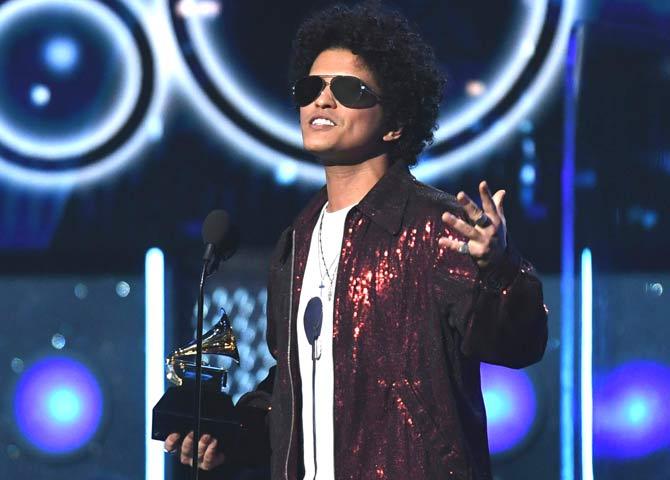 Bruno Mars receives a second Grammy for Record of the Year during the 60th Annual Grammy Awards show in New York. Pic/AFP