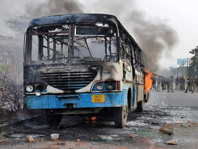 A Haryana roadways bus set on fire by alleged activists of the Karni Sena, at NH-248 during a demonstration against the release of 