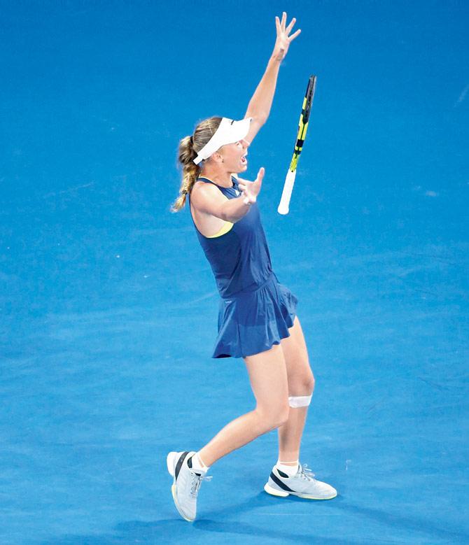 Denmarks Caroline Wozniacki celebrates beating Romania’s Simona Halep in the womens singles final at Melbourne on Saturday. pic/AFP 