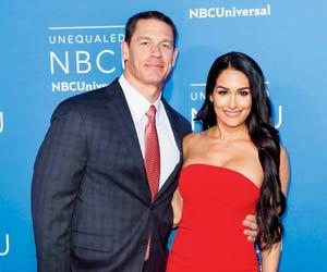 WWE couple John Cena and Nikki Bella get cosy during anniversary party