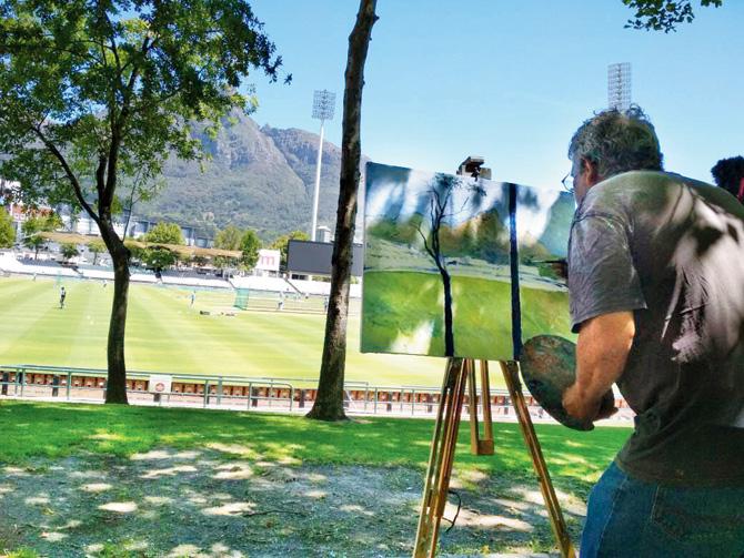  Enver Larney paints a section of the Newlands ground in Cape Town yesterday