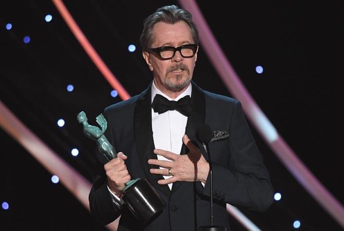 Actor Gary Oldman accepts the award for Best Actor during the 24th Annual Screen Actors Guild Awards show at The Shrine Auditorium in Los Angeles. Pic/AFP