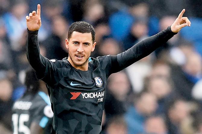 Hazard celebrates his brace on Saturday. Pics/AFP