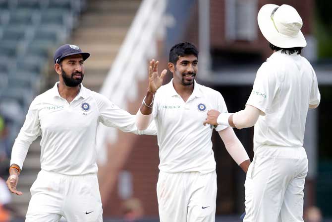 Indian bowler Jasprit Bumrah (C) celebrates the dismissal of South African batsman Lungi Ngidi during the second day of the third test match between South Africa and India at Wanderers cricket ground on January 25, 2018 in Johannesburg. Pic/ AFP