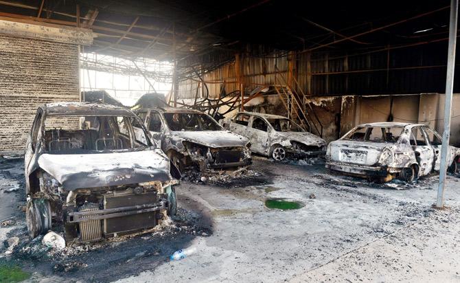 Charred remains of vehicles following the January 1 violence in Koregaon. Pic/PTI