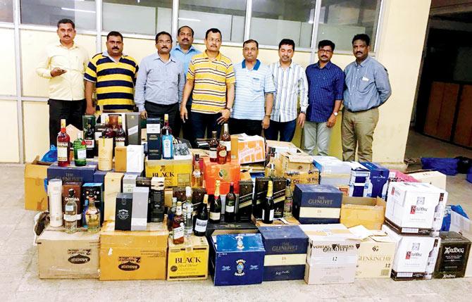 A total of 1,800 bottles were seized from the godown. Pic/Rajesh Gupta