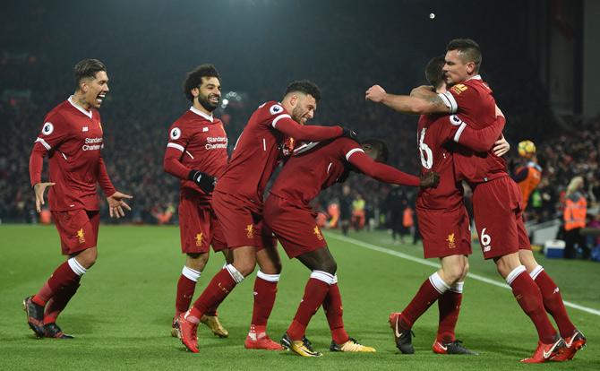 Liverpools Senegalese midfielder Sadio Mane (3R) celebrates scoring their third goal during the English Premier League football match between Liverpool and Manchester City at Anfield in Liverpool, north west England on January 14, 2018. Pic/ AFP