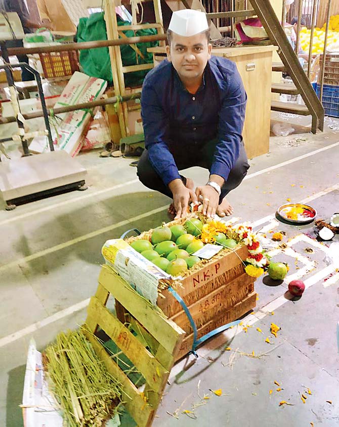 The Pansare family performed  a puja before the first box of mangoes on Thursda