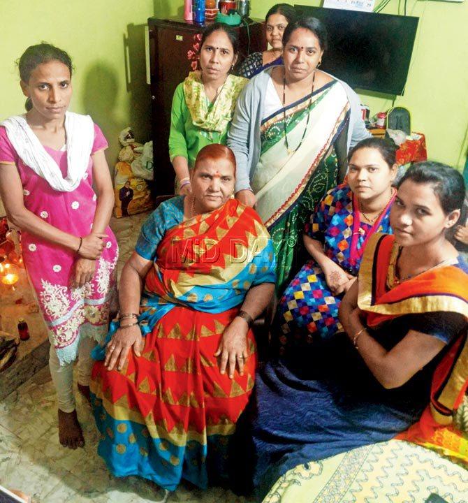 Meenabai Gulabsingh Bhat, 70, a member of the Kanjarbhat caste panchayat, who believes the V-Test is an acceptable ritual, but only to be discussed privately. She is surrounded by women, some married and others unmarried, who dismiss allegations that their community carries out this ritual