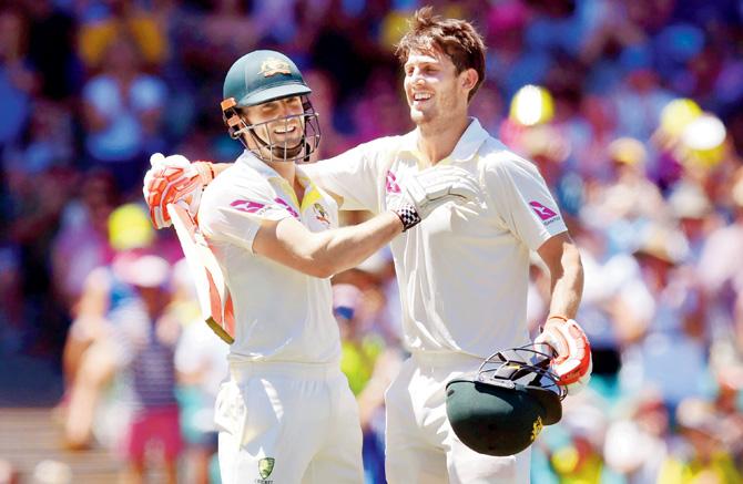 Australias Mitchell Marsh (right) celebrates his century against England with brother Shaun in Sydney yesterday. PIC/AFP
