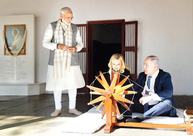 Prime Minister Narendra Modi with Israeli Prime Minister Benjamin Netanyahu and his wife Sara at Sabarmati Ashram. Pic/PTI