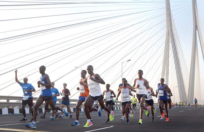 Participants at Tata Mumbai Marathon 2018 at Worli Sealink in Mumbai on Sunday. Pic/PTI