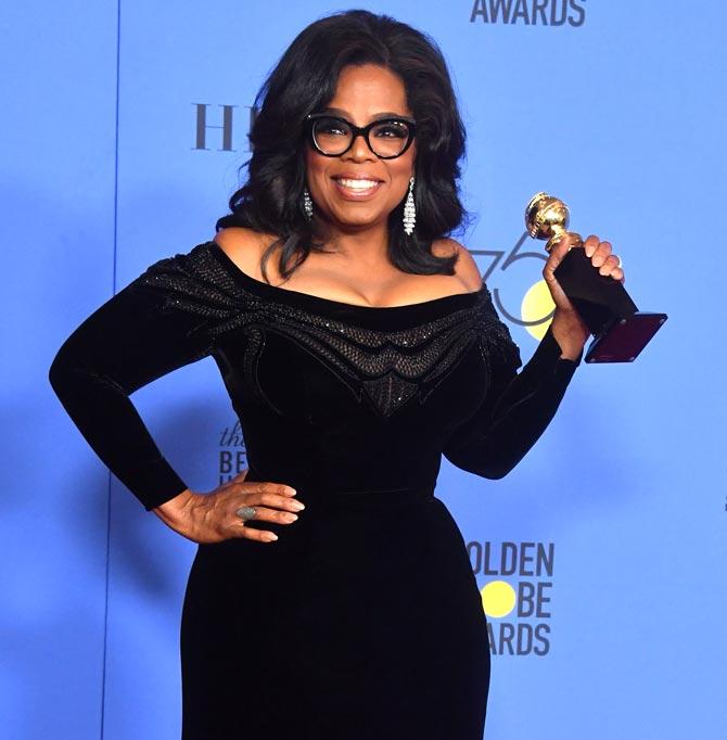 Actress and TV talk show host Oprah Winfrey poses with the Cecil B. DeMille Award during the 75th Golden Globe Awards. Pic/AFP