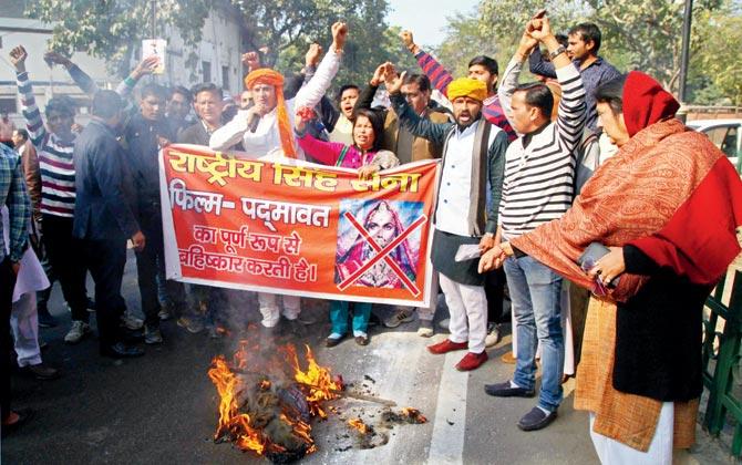 Rashtriya Singh Sena members raise slogans against the release of Bollywood film Padmaavat, in Meerut on Friday