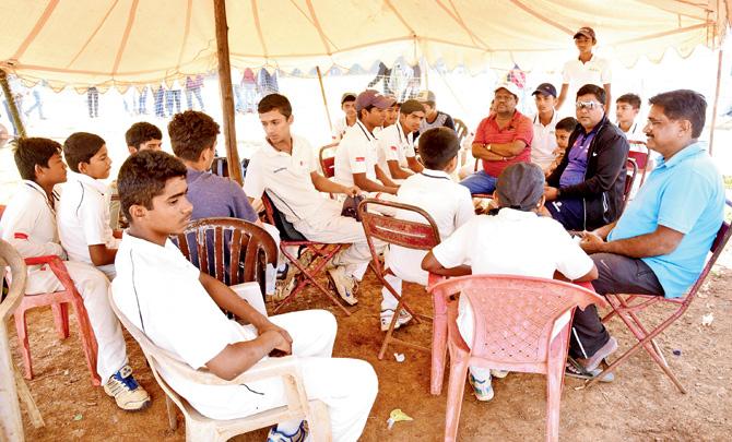 Rizvi Springfield players and coaches wait for their opponents Swami Vivekanand to arrive at Azad Maidan yesterday. PIC/SURESH KARKERA 