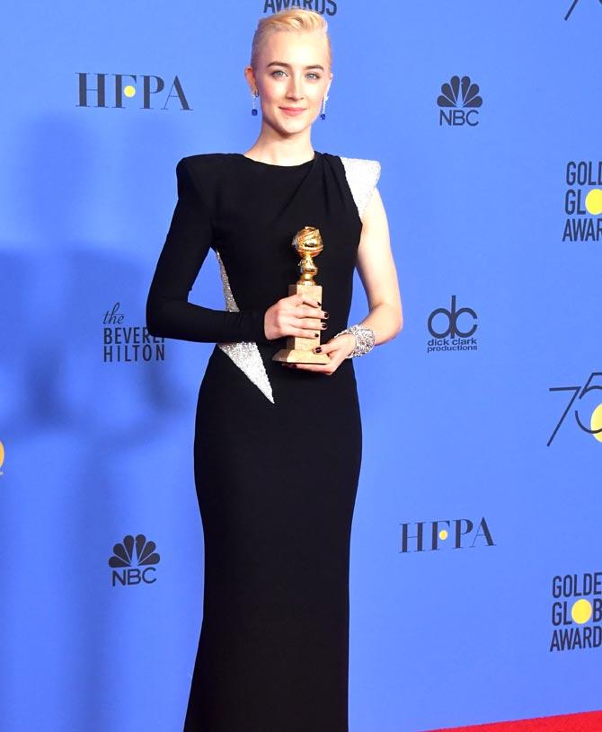 Saoirse Ronan poses with the trophy for Best Performance by an Actress in a Motion Picture - Musical or Comedy during the 75th Golden Globe Awards. Pic/AFP