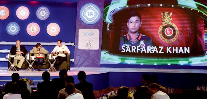 Sunrisers Hyderabads mentor VVS Laxman speaks while an image of RCB’s retainee Sarfaraz Khan is displayed on a screen during the IPL Player Retention announcement yesterday. PIC/suresh karkera